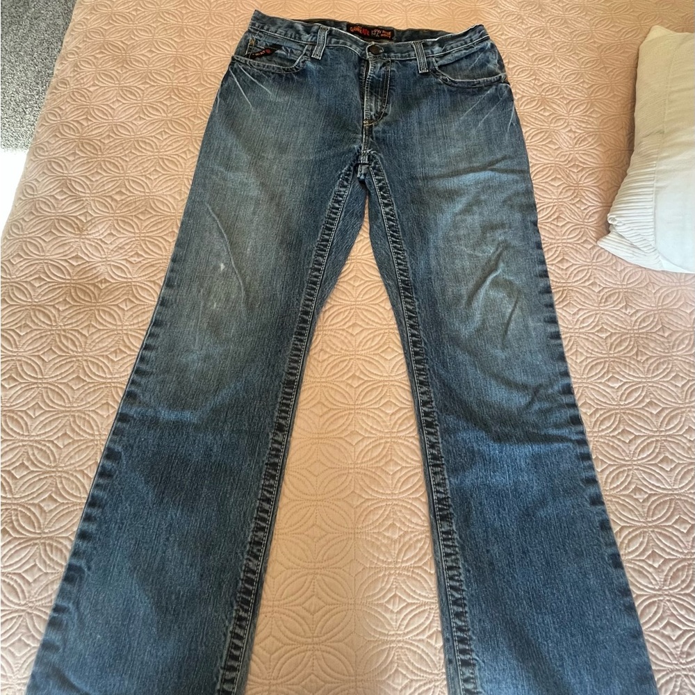 2 pair of Mens Ariat FR Low Rise Bootcut jeans. Size 34/32 GUC